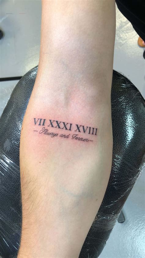 2009 roman numeral tattoo